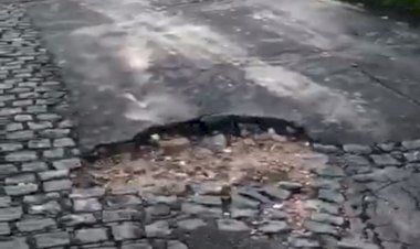 Motoristas e pedestres sofrem com buracos em rua do Sítio dos Pintos no Recife